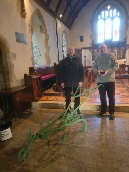 Rev Dr Paul Fitzpatrick Rector of Ashwater and Tony March a PCC member with one of the ploughs