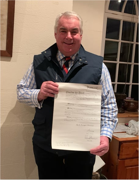 The speaker at this month's Coads Green Women's Institute meeting was Mark Thomas who is pictured here holding his CVO certificate, a New Year’s Honour, presented to him by King Charles, in 2023