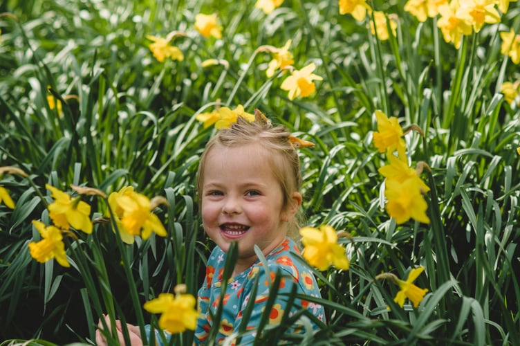 A child enjoys spring at Cotehele in Cornwall. 