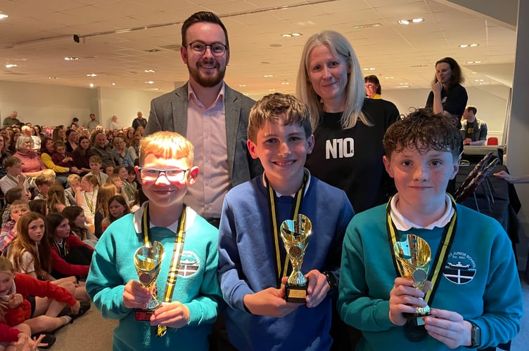 Year 5/6 award winners Rafe Jackson (Duloe), Alfie Nicholson 
 and Micah Martin (Carbeile) alongside Josh Mitchell from Parkes & Pearn Estate Agents and East Cornwall Harriers chairman Lucy Oldham