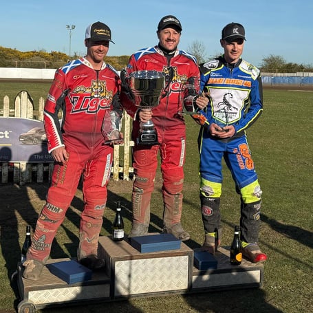 Cornishman Chris Harris (centre) celebrates his Championship League Riders’ title success alongside Kyle Howarth (left) and Steve Worrall (right)