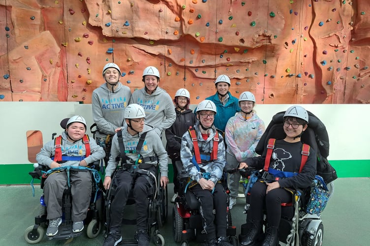 Youngsters from Active8 are all smiles at a rockclimbing session