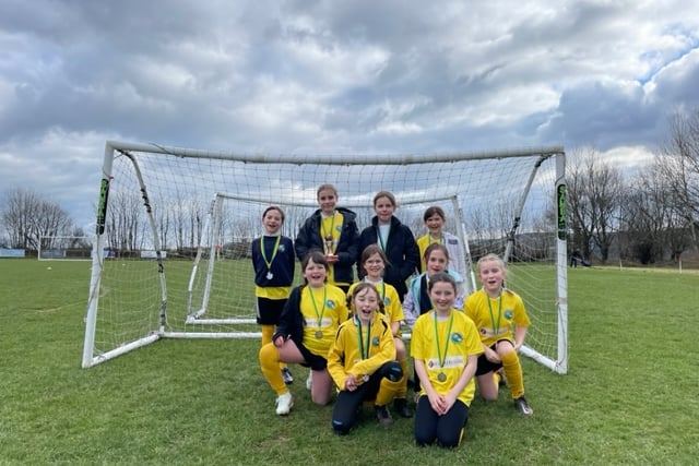 The Hatherleigh Primary School girls football team with their new kits. (Picture: Hatherleigh Nursing Home)