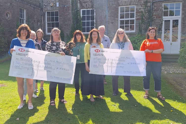 The Friends of Pencarrow trustees presenting cheques to two charities who benefitted from their annual Snowdrops Weekend. (Picture: Friends of Pencarrow House)