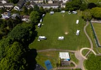 Travellers move into town park in Cornwall with cars and caravans