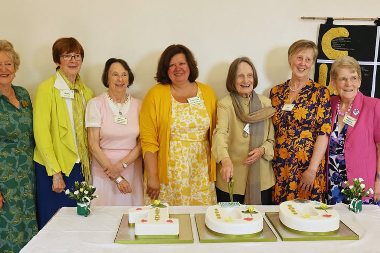 Alice Brown, who has been part of the Women's Institute (WI) for 60 years, cut the special centenary cake for Lezant WI. (Picture: John Davies) 