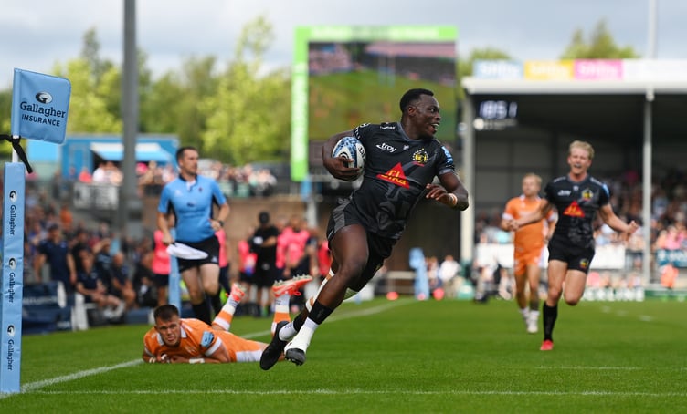 Exeter Chiefs winger Paul Brown-Bampoe crosses for his side's opening try in the weekend clash with Sale Sharks