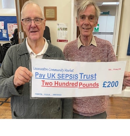 Victor Briggs from SEPSIS Cornwall (left) receiving the donation from Paul Jellyman from the Launceston Community Market