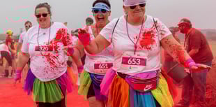 Runners covered in the colours of the rainbow for charity fun run
