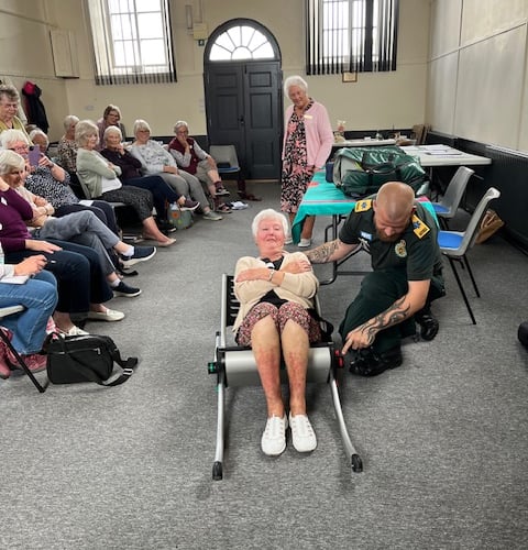 Scott, a Bude First Responder, showing members of Marhamchurch WI some of the equipment they use