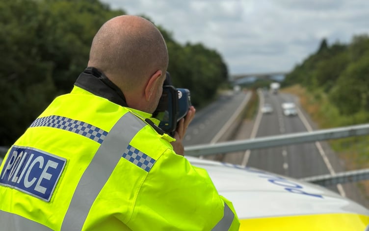 A policeman checks the speed of motorists in Cornwall
