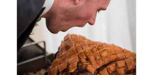 Groom's hog roast challenge at wedding