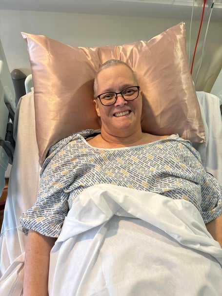 Karen Davey in hospital. A woman has been left unable to walk after her cancer symptoms were mistaken for menopause symptoms.Karen Davey, 54, started experiencing fatigue, hot flushes, and loss of appetite - leading her to believe she was experiencing symptoms of menopause. After being hospitalised for two weeks, she was diagnosed with stage four non-Hodgkin lymphoma in her kidneys - with a tumour wrapped around her spinal cord.Due to the spinal cord injury it caused, Karen cannot walk and is now a full-time wheelchair user.

