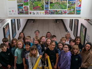 Schoolchildren unveil blossom inspired artwork at station