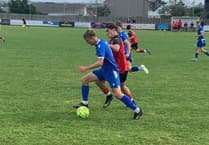 Woodland's late header earns Bude third straight victory