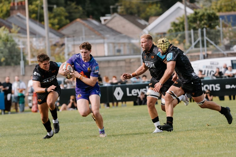 Exeter Chiefs centre Nick Allison picks a way through the Ospreys defence in their pre-season clash at the Brewery Field