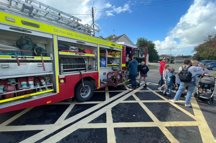 Attendees at the Holsworthy Fire Station open day are shown a demonstration of one of its engines (Picture: Holsworthy Fire Station)