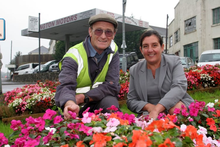 Roger Denley tendering to the flower beds in his official capacity as lead groundsman for the council in 2005.