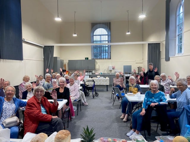 Members of Marhamchurch Women's Institute enjoying their annual harvest auction and lunch