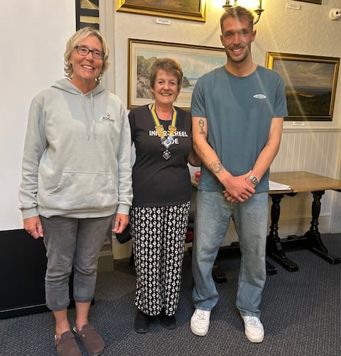 Bude Inner Wheel president Mandy Hamley with Cyril and Gill Cox from Adsurf