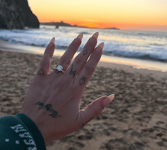 Jesy shows off her engagement ring with the Atlantic Hotel in the background (Picture: Jesy Nelson/Instagram)