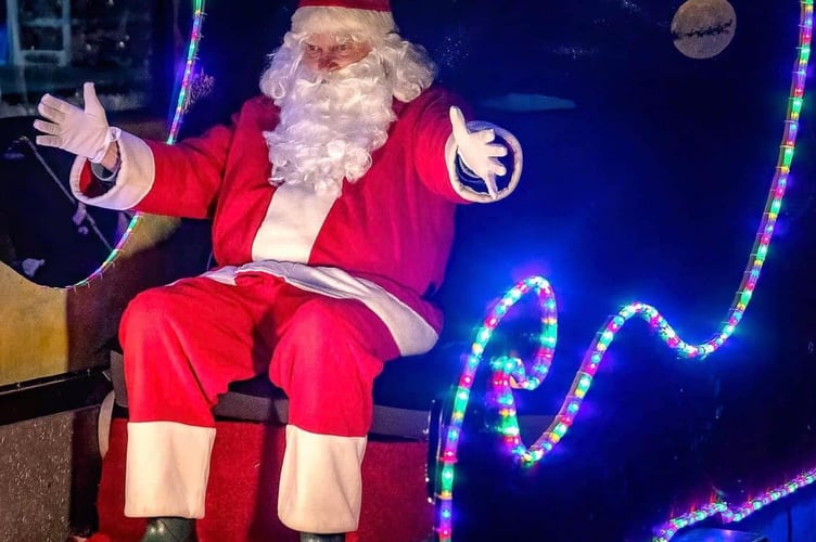 Father Christmas on his visits to Bodmin with the town's lions. (Picture: Leonard Reid/Bodmin Camera Club)