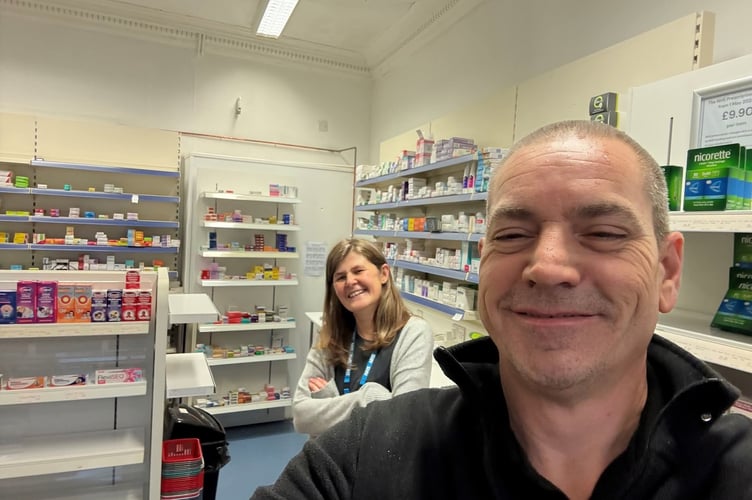 Cllr Jon Hutchings, mayor of Holsworthy pictured with a staff member at Allied Pharmacy (Picture: Jon Hutchings)