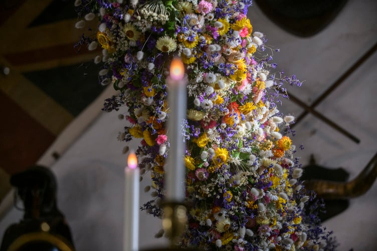 Record-breaking year for Cotehele's famous Christmas Garland
38,000 dried flowers grown, harvested and hand-placed at the National Trust estate in Cornwall
Cotehele celebrates its biggest ever garland, created from 38,000 home-grown flowers
deal growing conditions made 2025 a bumper year for key blooms including paper daisies, bunny tails and statice
Visitors can see the full 60ft garland in the Great Hall daily from Saturday, 22nd November - Monday, 5th January (closed 25th - 26th December), 10.30am - 4pm
Cotehele's celebrated Christmas Garland has reached record heights this year, as gardeners announce a remarkable 38,000 flowers grown, picked, stripped, dried and prepared on site for the 2025 display.
Thanks to a near-perfect spring and summer - with a balanced mix of sunshine, warmth and timely rainfall - the garden team enjoyed one of their most successful growing seasons in decades
