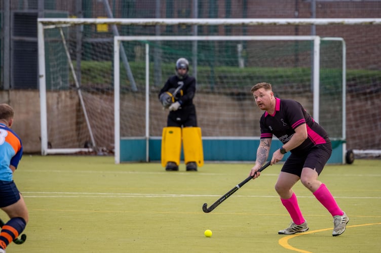captain Steve McLellan getting his head up to try and find a pass out of defence.