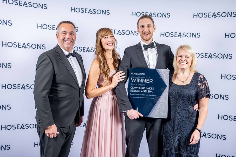 Members of the Clawford Lakes Resort and Spa team - Sonja Tambyapin, Elliot Hassall and Tamsin Cornforth - receive their award. (Picture: Hoseasons)