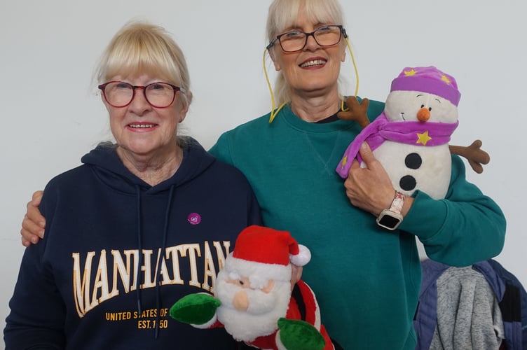 Kerry and Shelia with an assortment of Christmas toys