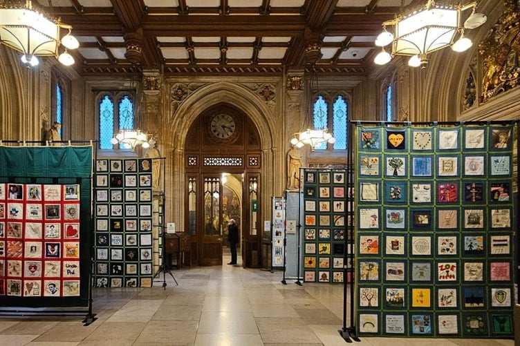 The Speak Their Name quilts on display at the Houses of Parliament.