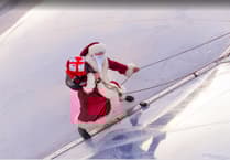 Santa shows at Eden Project in Cornwall how he gets to the ground without a chimney