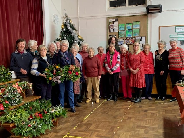 Barbara Sleep, bottom left, led the wreath and Christmas arrangement workshop for the Coad’s Green Women on Wednesdays group