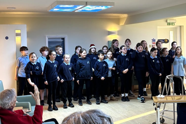Holsworthy Primary School singing to residents at Deer Park Nursing Home (Picture: Camelot Care)