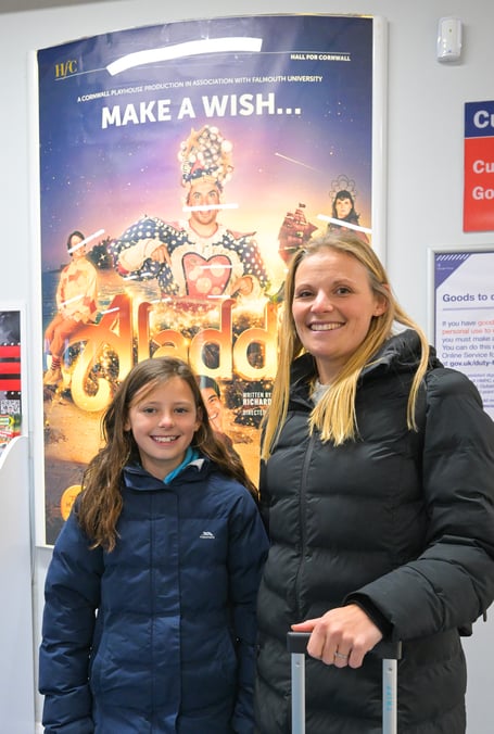 NEWQUAY AIRPORT, CORNWALL : December 20th 2025 : 2025 Pantomime Make a Wish campaign : Ella May arrives  with her mother Zenna from the Isles of Scilly with her surprise tickets to see Aladdin at the Hall for Cornwall. Photographed for the Hall for Cornwall by Hugh Hastings.