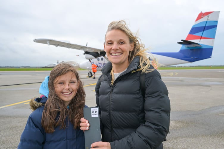 NEWQUAY AIRPORT, CORNWALL : December 20th 2025 : 2025 Pantomime Make a Wish campaign : Ella May arrives  with her mother Zenna from the Isles of Scilly with her surprise tickets to see Aladdin at the Hall for Cornwall. Photographed for the Hall for Cornwall by Hugh Hastings.