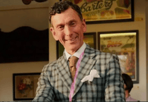 One of two men missing from a festive Budleigh Salterton swim has been named