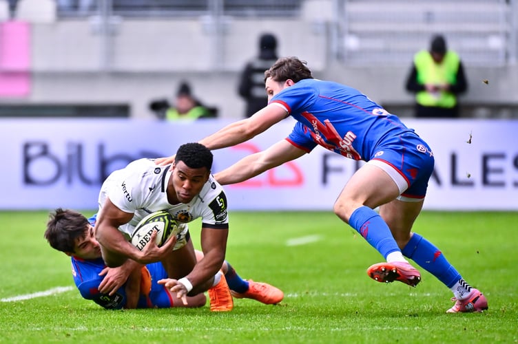 Exeter Chiefs winger Immanuel Feyi-Waboso is brought to the floor during the EPCR Challenge Cup match with Stade Francais
