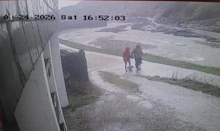 Detectives would like to identify the two dog walkers pictured