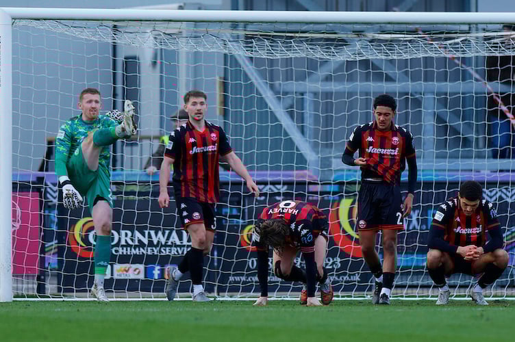 Dejection for Truro City players after goal celebrations for Aidan Francis-Clarke of Braintree Town as he heads the ball into the net with his scecond and winning goal in the 95th minute of extra time during the National League match between Truro City and Braintree Town at Truro Sports Hub Stadium, Truro on 28 February 2026 (Photo: Phil Mingo/PPAUK)
