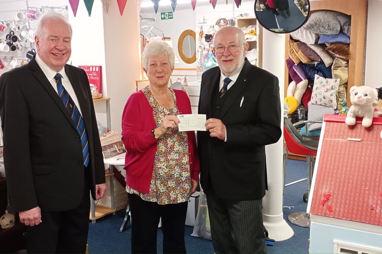 Jeff Green and John Weller of Bude's Granville Lodge of Freemasons presented a cheque for £250 to Margaret Wilsher, at Bude & District Age Concern