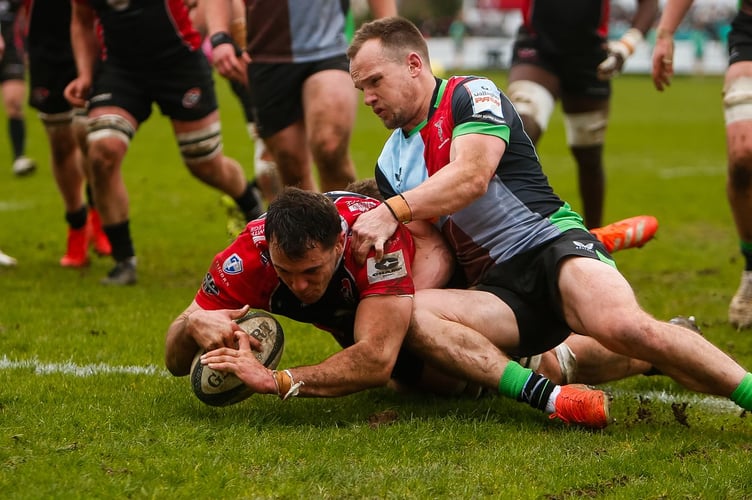 Cornish Pirates forward Luke Radcliff powers past Harlequins scrum-half Stu Townsend to score his try (Picture: Brian Tempest)