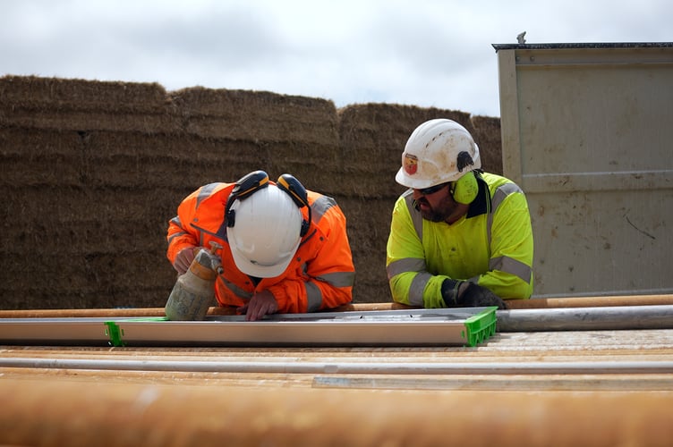 Staff from Cornwall Resources Limited inspect core samples from their Redmoor project, near Callington
