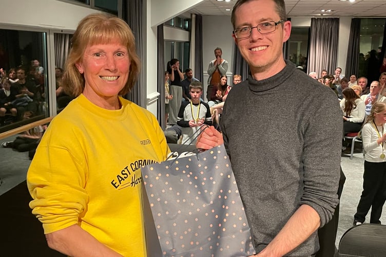 Organiser Revis Crowle (left) announced she was stepping down from her role after 23 years - and was presented with some goodies by East Cornwall Harriers chairman Matt Davies