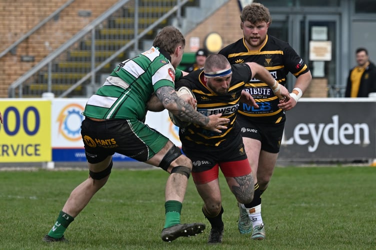 Ben Hancock of Cornwall (Launceston) is tackled by Michael Rickard of Devon (Devonport Services). - Photo mandatory by-line: ©Simon Bryant/Iktis Photo - 04/04/26, Cornwall, Devon, Tamar Cup, Friendly, Sport, Rugby Union, Brickfields, Plymouth, England