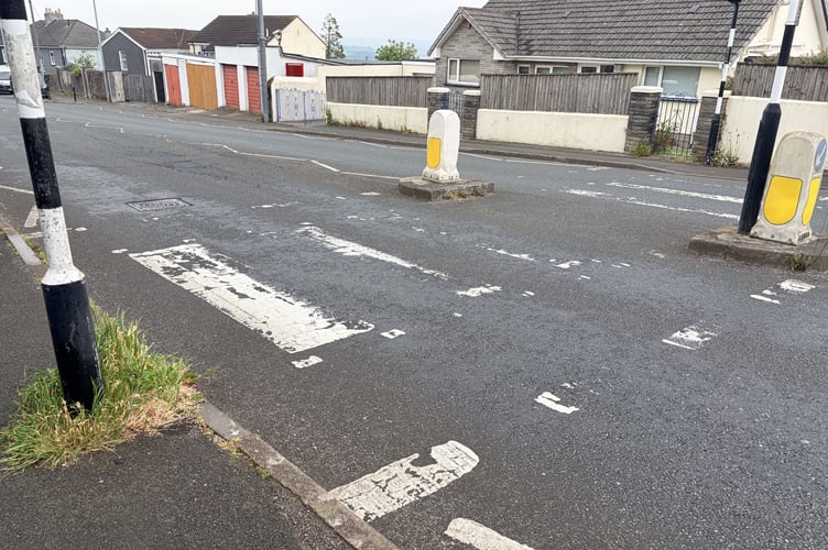 Road markings on this pedestrian crossing in Saltash have all but gone