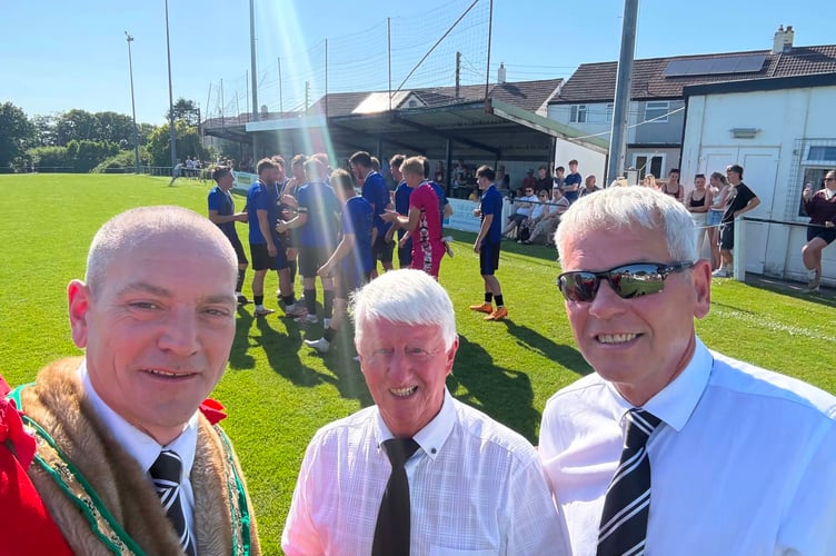 Cllr Jon Hutchings with other representatives while the teams warm up in the background (Picture: Cllr Jon Hutchings)