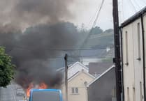 Crews called as bus goes up in flames in Callington