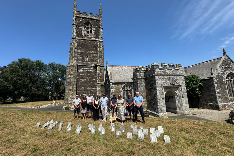 Those attending stood in silence facing 39 commemorative slates, each bearing the name and age of a miner